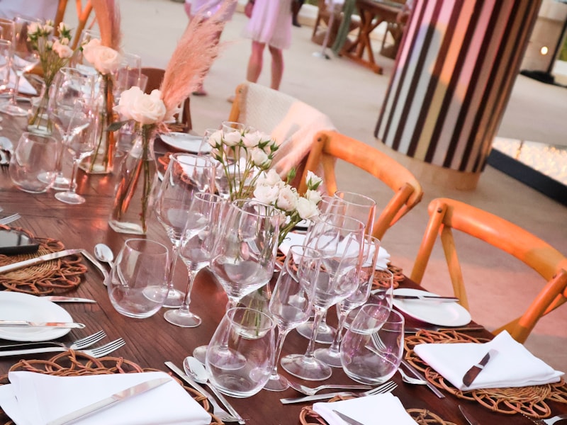 Detailed place setting with rattan chairs and linen-dressed table
