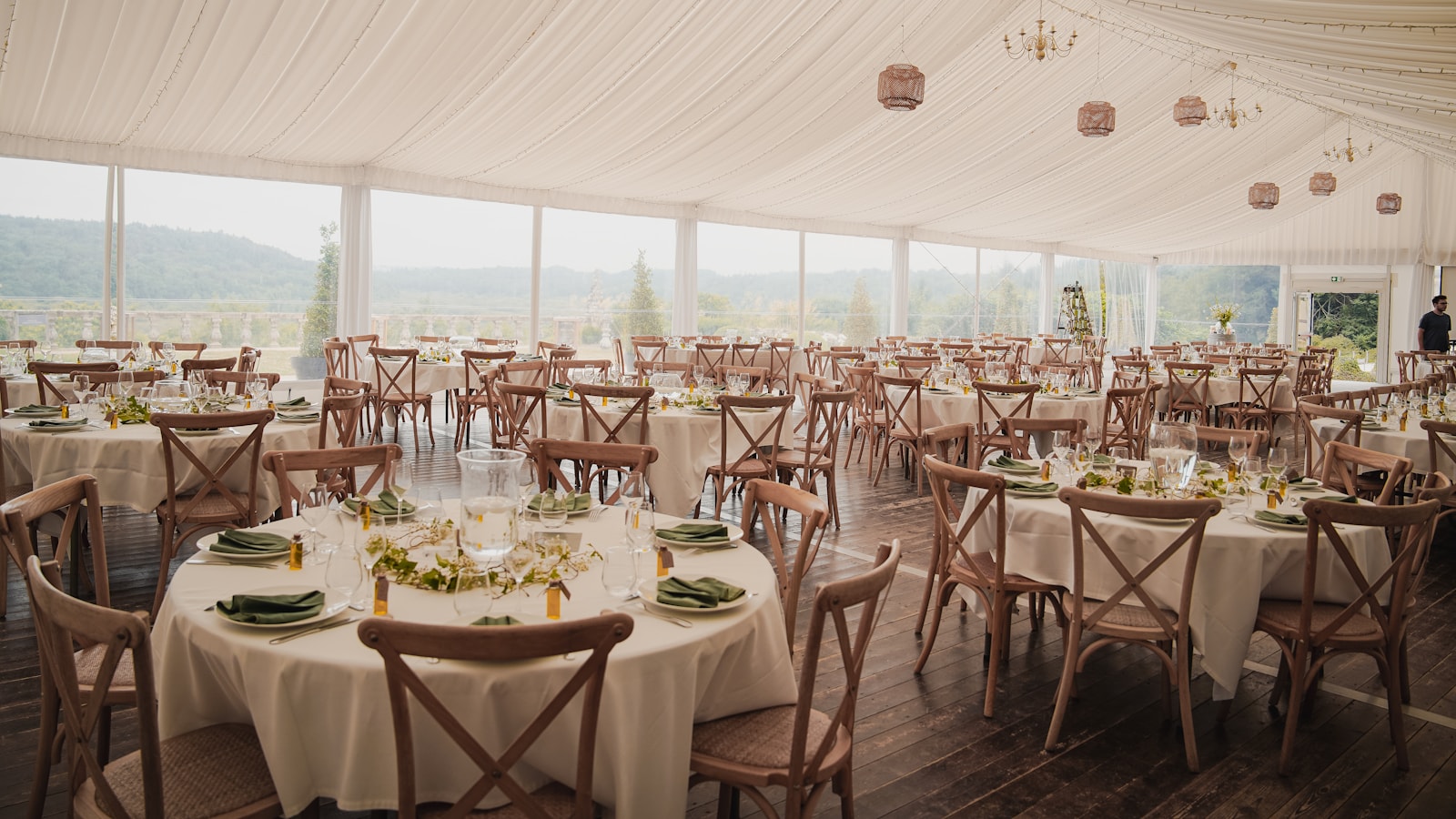Wedding marquee setup with styled tables