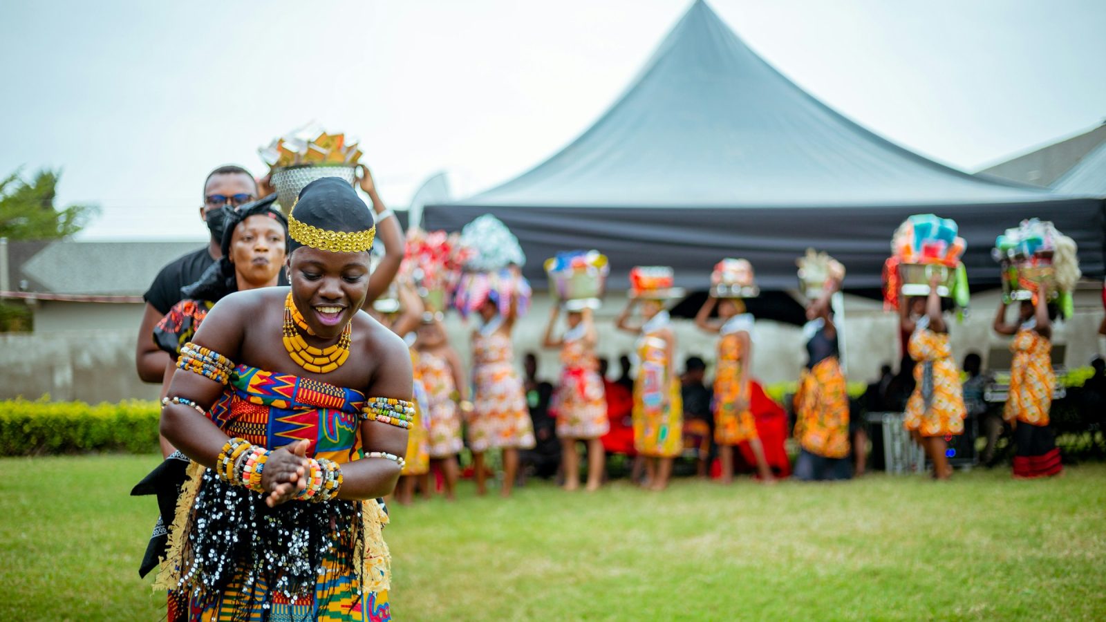 Group of people in traditional African dress at a ceremony
